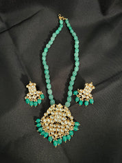 "Royal Elegance: Kundan Pendant with Green Beaded Necklace Set"