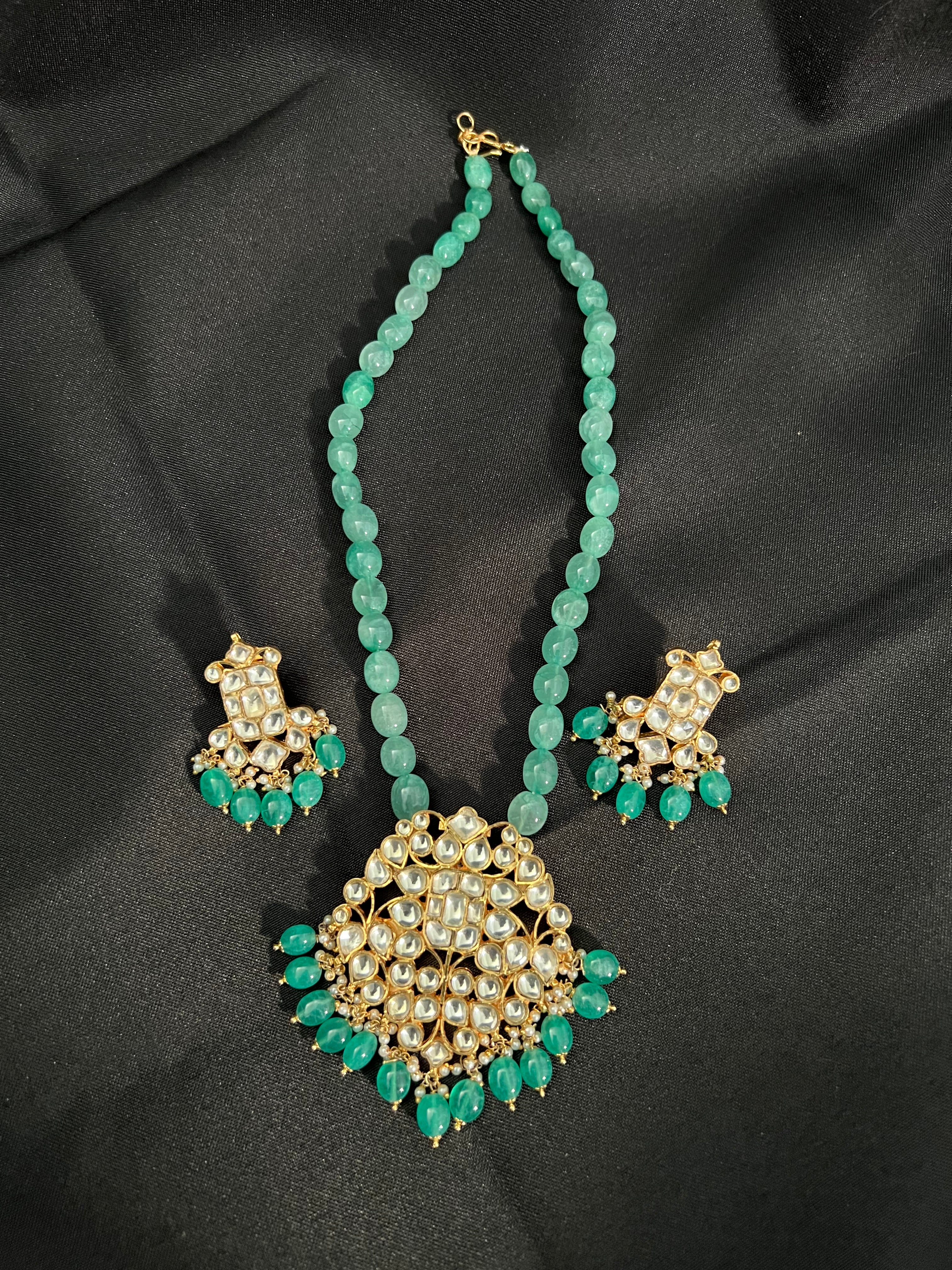 "Royal Elegance: Kundan Pendant with Green Beaded Necklace Set"