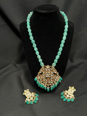 "Royal Elegance: Kundan Pendant with Green Beaded Necklace Set"