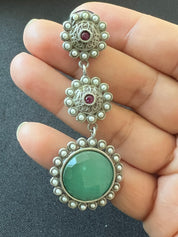 "Emerald Halo: Circular Oxidized Gemstone and Moti Earrings"